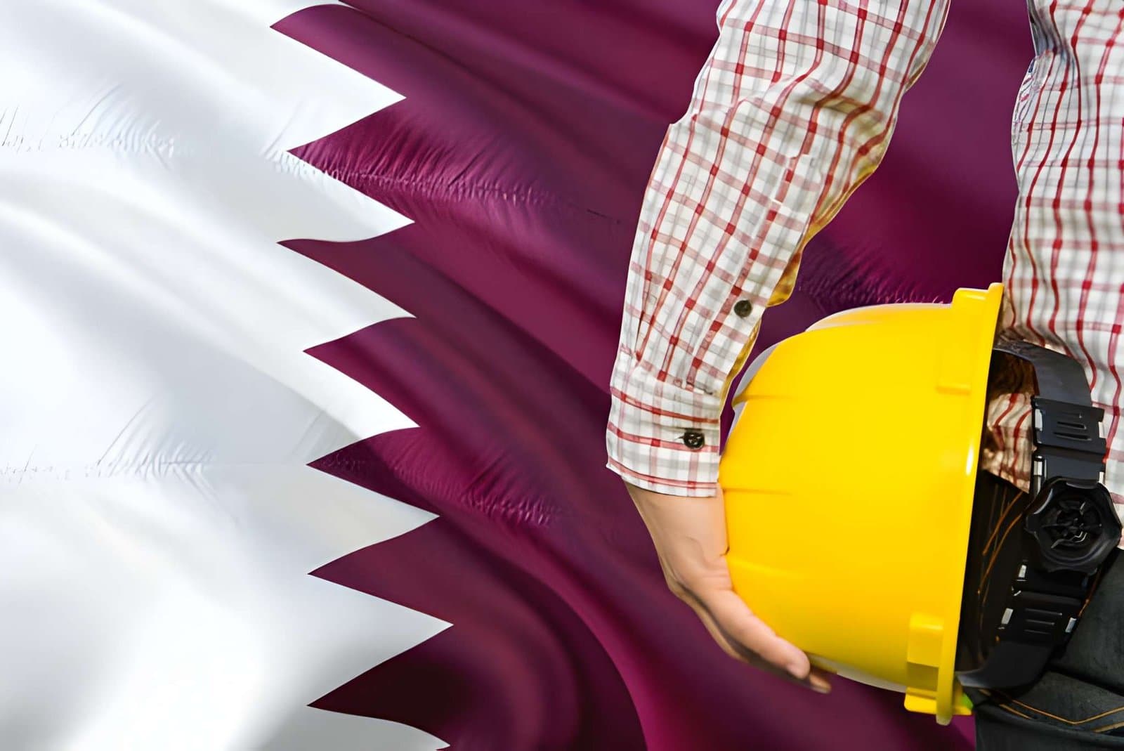 Energy professional with safety hard hat against the Qatar flag — oil and gas careers and LNG recruitment