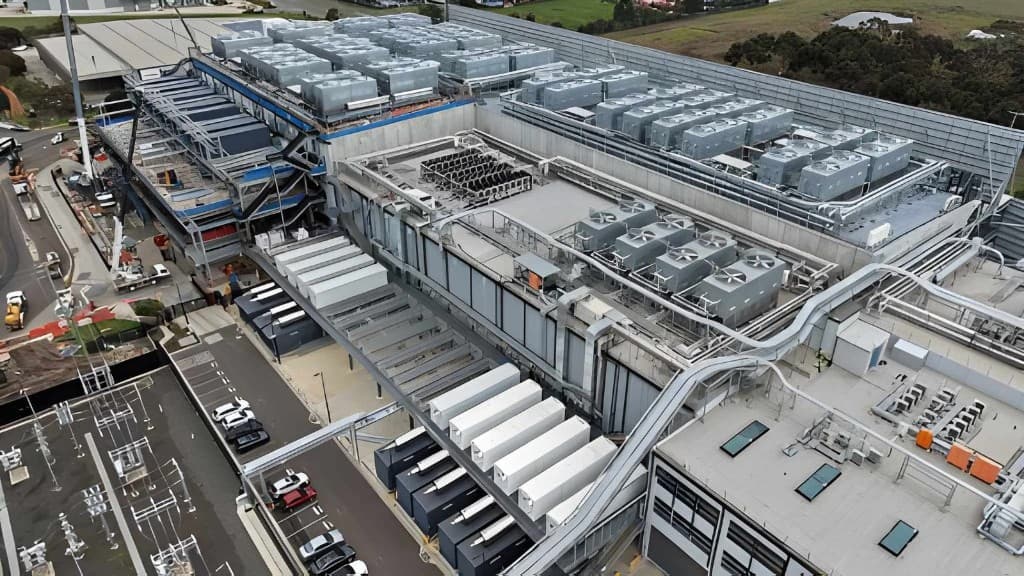 Aerial view of a data centre with rooftop cooling systems, generators and electrical infrastructure