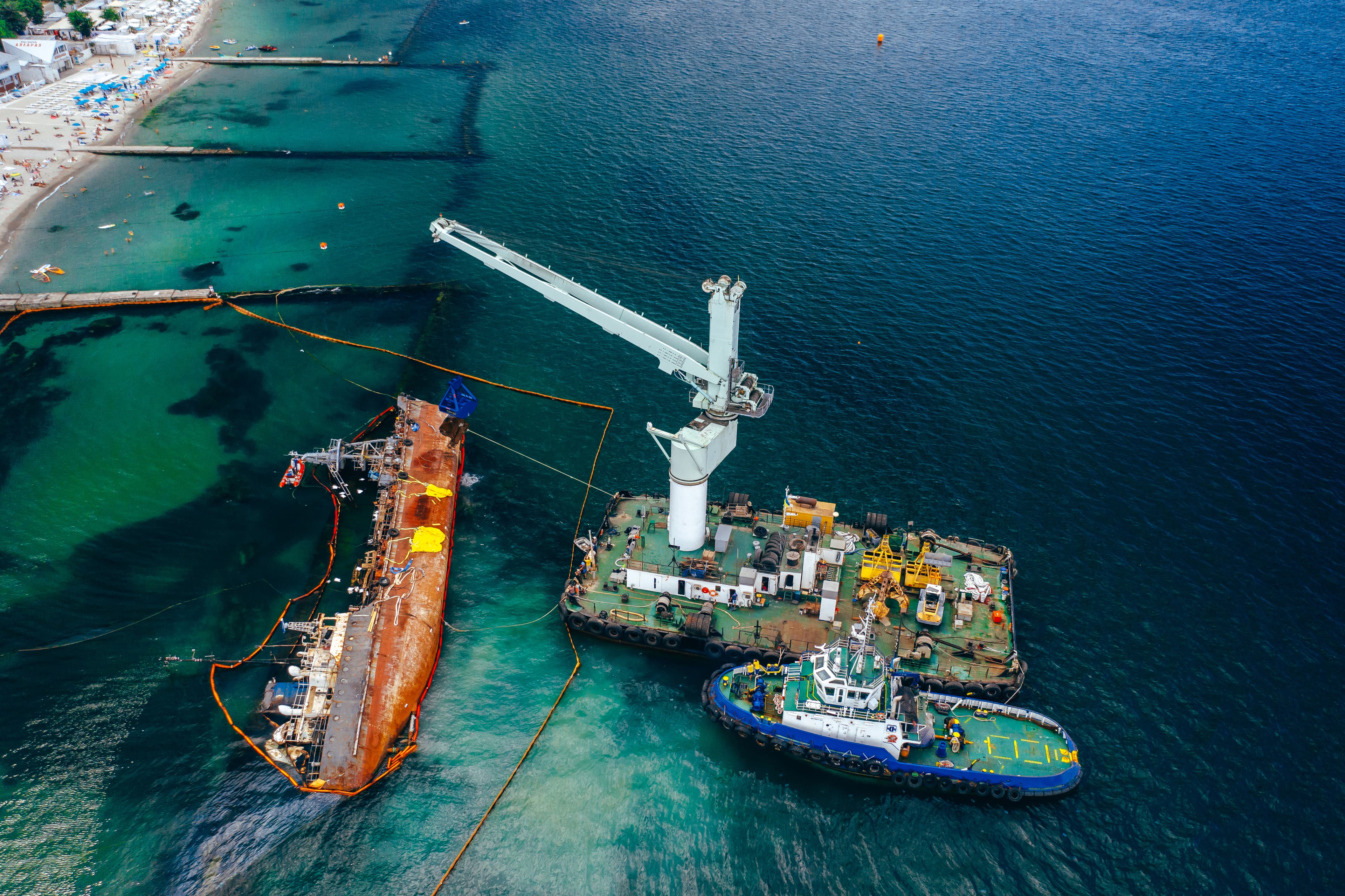 Top-down view of an offshore tanker aground near the coast in the UK energy sector